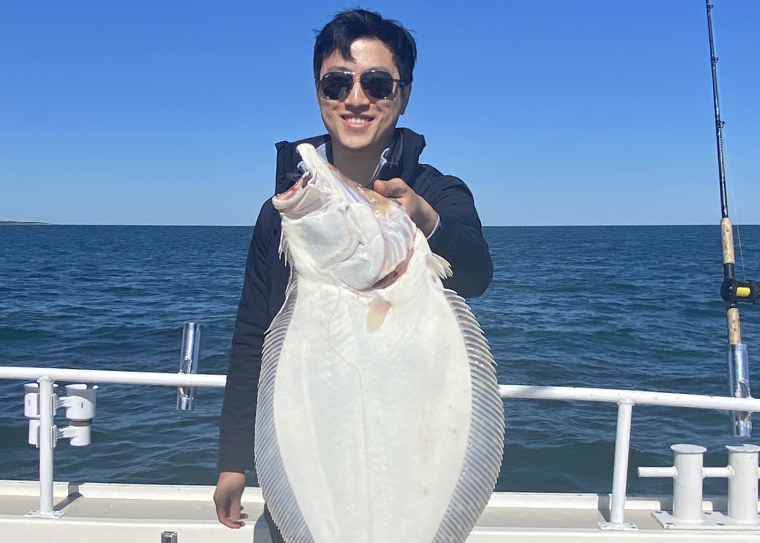 A man holding a fluke