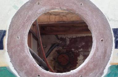  Looking from outside the boat through the hole where the flanges are. Looking into the hole, you can see the forward holes already filled in.