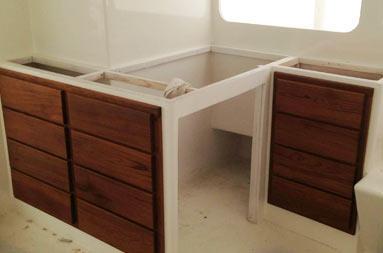 Interior shot. Zoomed out view of the drawers on the port side of the boat in the deckhouse