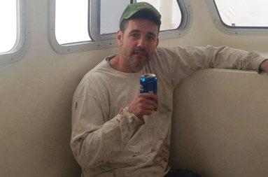 Captain Steve sitting inside the deckhouse, taking a break after a long day's work