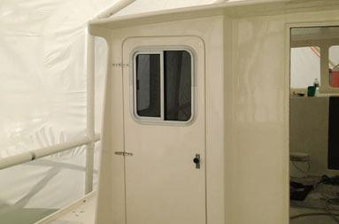 View of the door and sliding window of the bathroom from outside on the deck