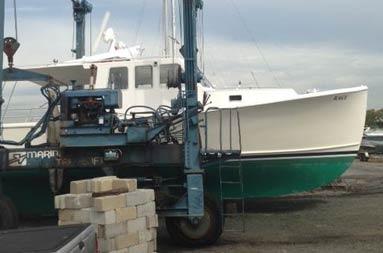 The boat after just being hauled to the lot at Atlantic Service and Equipment