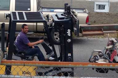 Joe, from T&S Marine uses a lift to drive it to another part of the marina