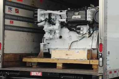 View from the back of a delivery truck with the new engine inside