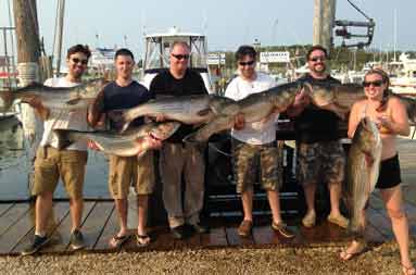 Some of today's customers back at the marina showing off a few bass.