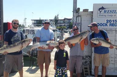 The group showing off their catch.