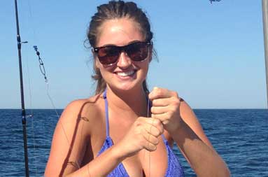 One of the women holding up the porgy she caught