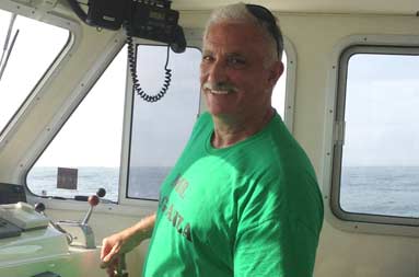 Jill's dad, Joe, at the captain's wheel