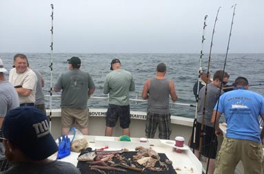 View from inside the cabin looking out at the deck at everyone fishing.
